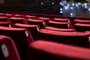Empty Theater Chairs Empty theater with red chairs. Rear view.