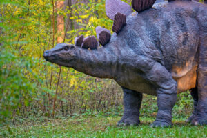 Big model of prehistoric dinosaur in nature. Realistic scenery. Big model of prehistoric dinosaur in nature. Realistic scenery.